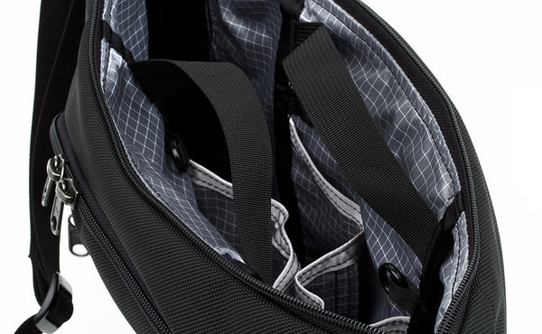 Close shot of zippable interior pockets in the main compartment.